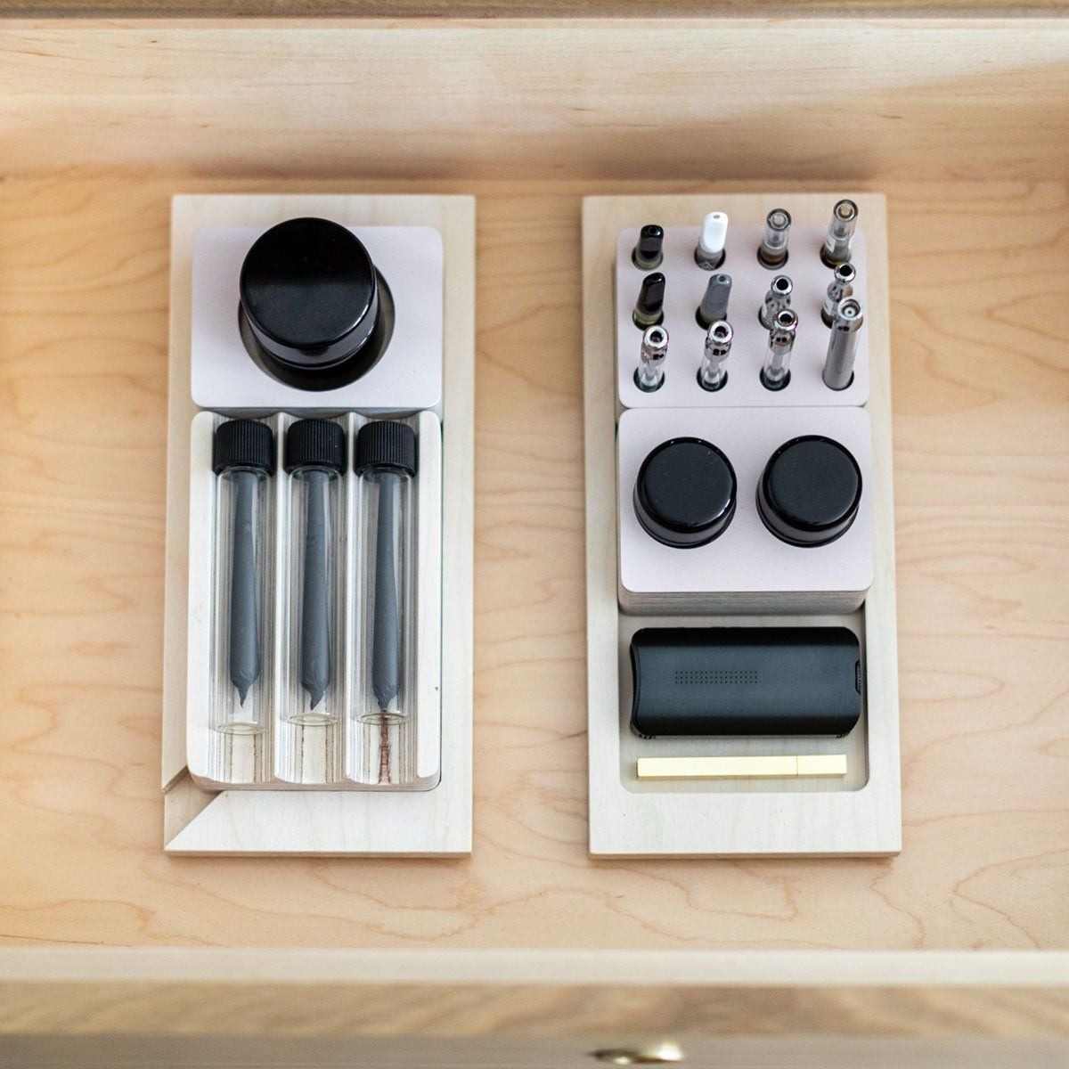 Vape cartridges, flower jars, and pre-rolls are all neatly organized within Forti Goods' modern cabinets and credenzas. 