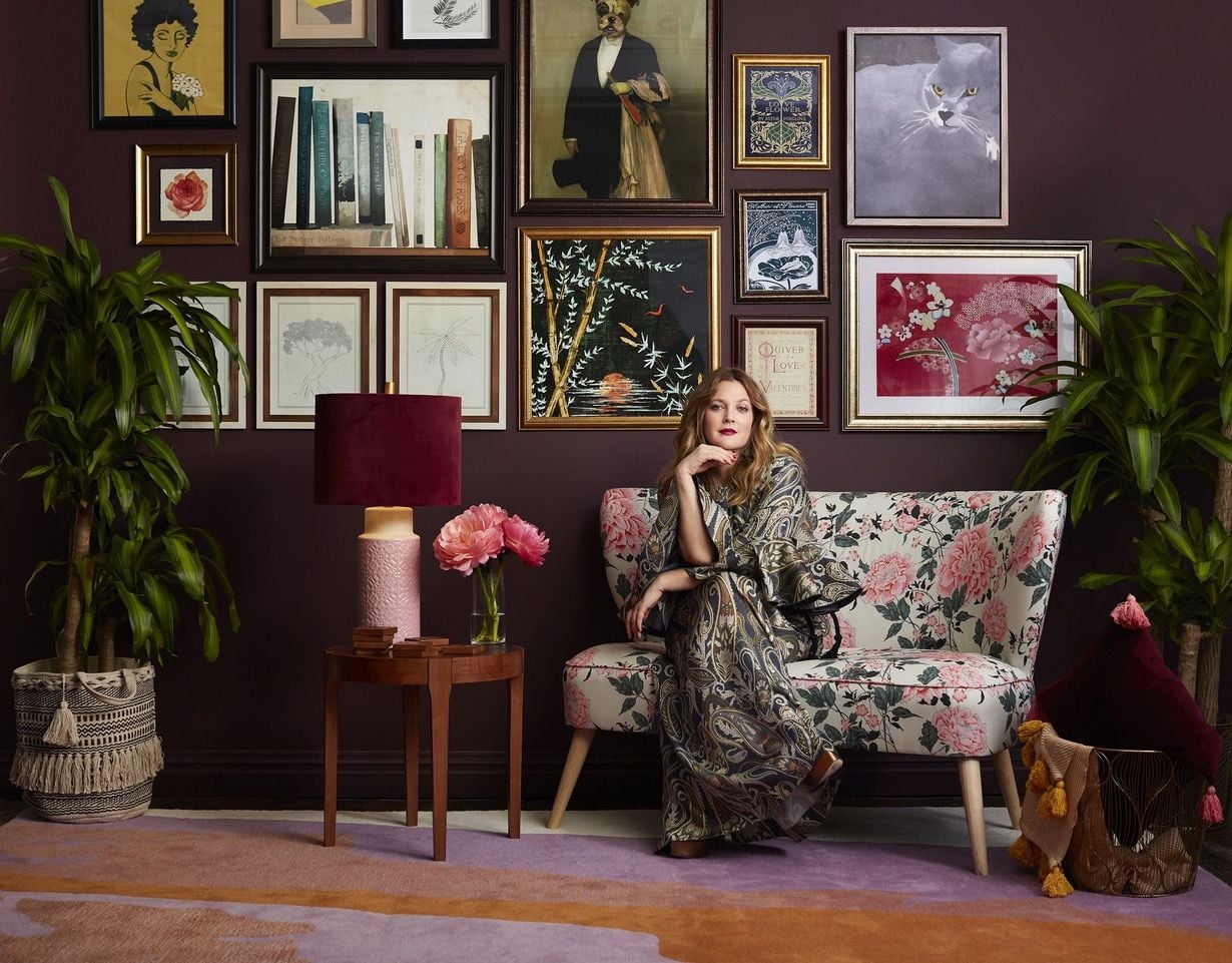 Drew Barrymore sits in a space decked out in her new 