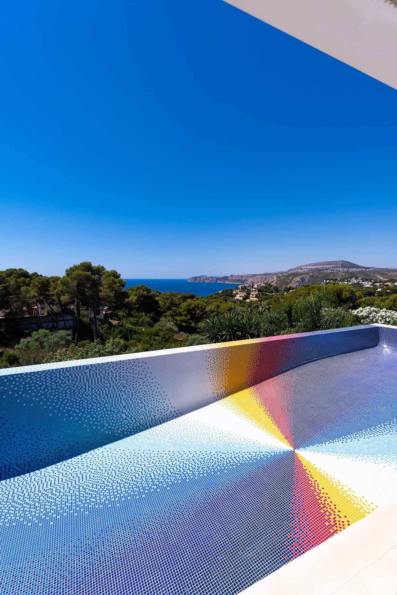 Felipe Pantone's colorful pinwheel pool design in Javea, Spain. 