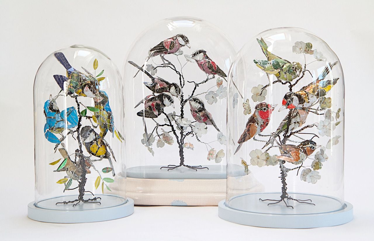 Gorgeous upcycled metal birds in bell jars, all crafted by Barbara Franc. 