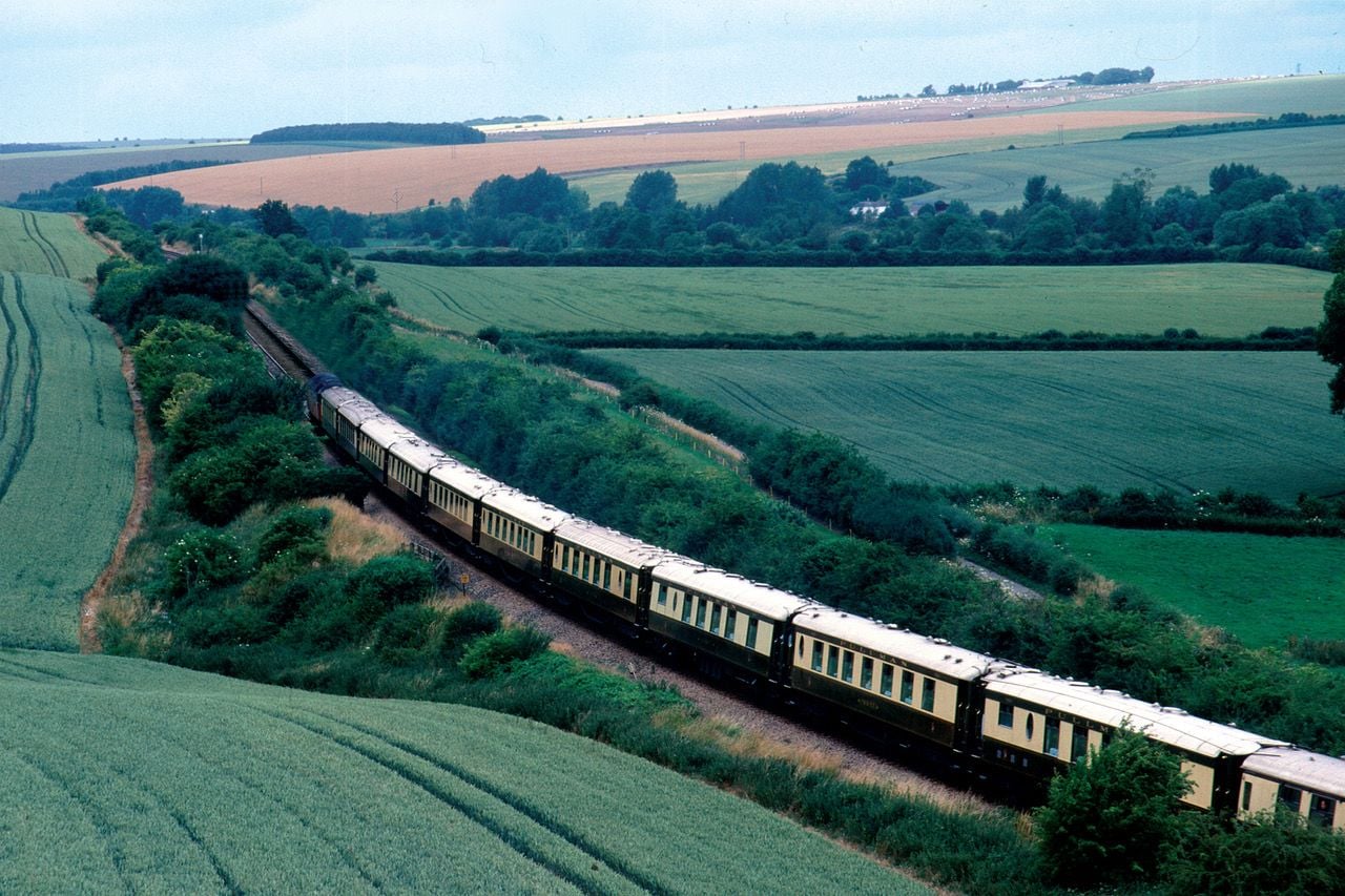 The Belmond British Pullman Train rolls through the English countryside.