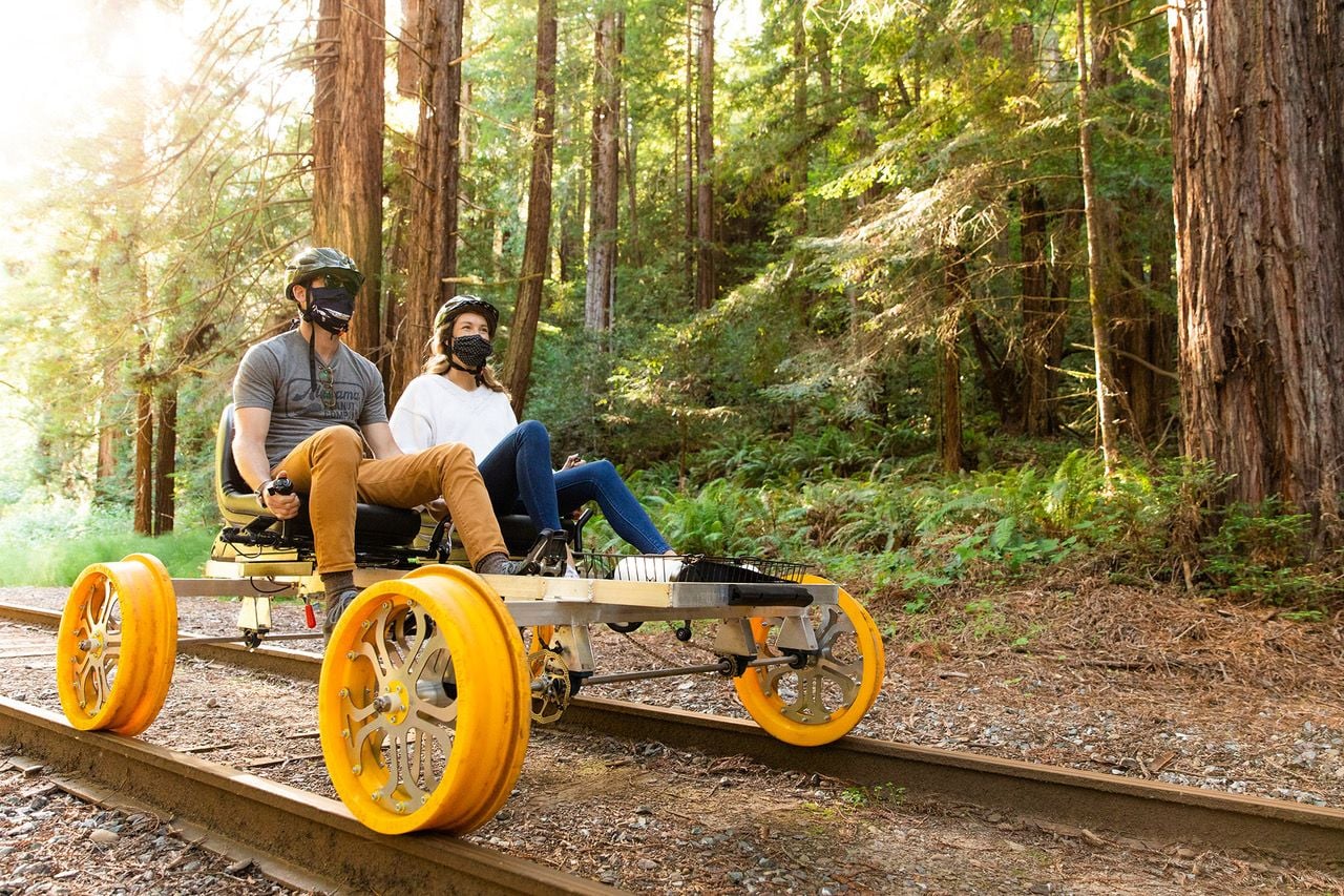 Couple zips through the California redwood forests on an all-electric Skunk Train railbike.