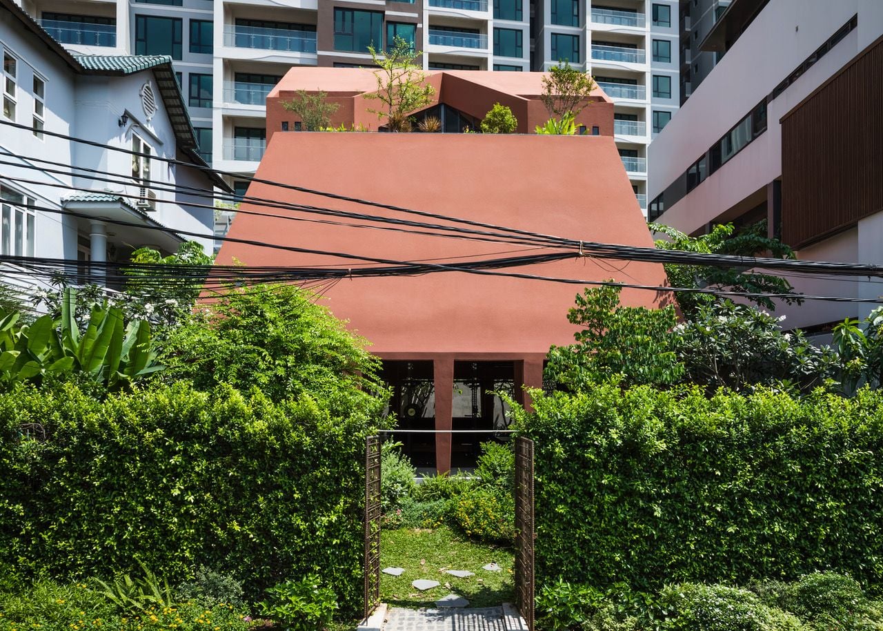 Red Cave House Turns an Ordinary City Block into a Lush Jungle