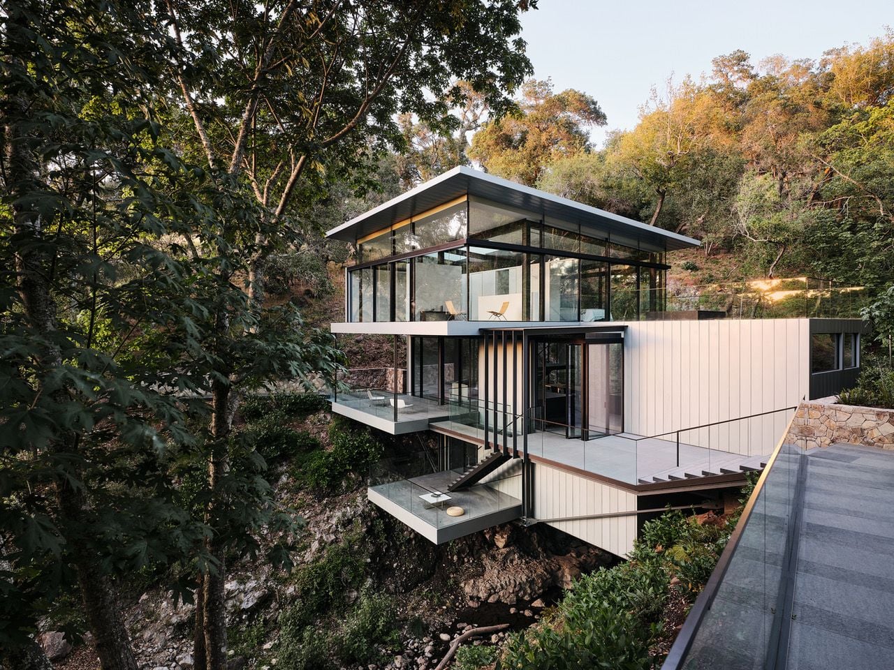 Each level of the Suspension House has its own enclosed glass balcony.