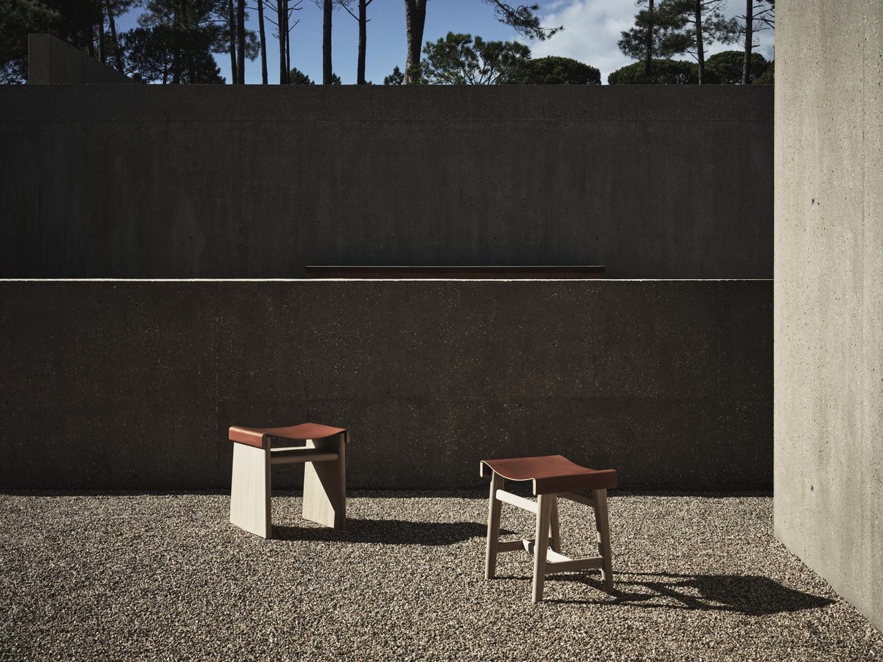 Simple stools from Zara's new furniture collection with Vincent Van Duysen add character to this outdoor space. 
