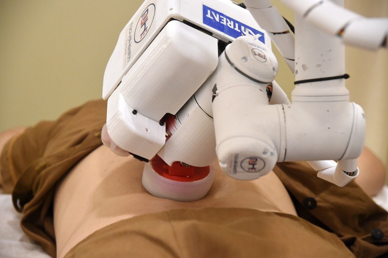The robotic EMMA masseuse gives a patient a much-needed back rub. 