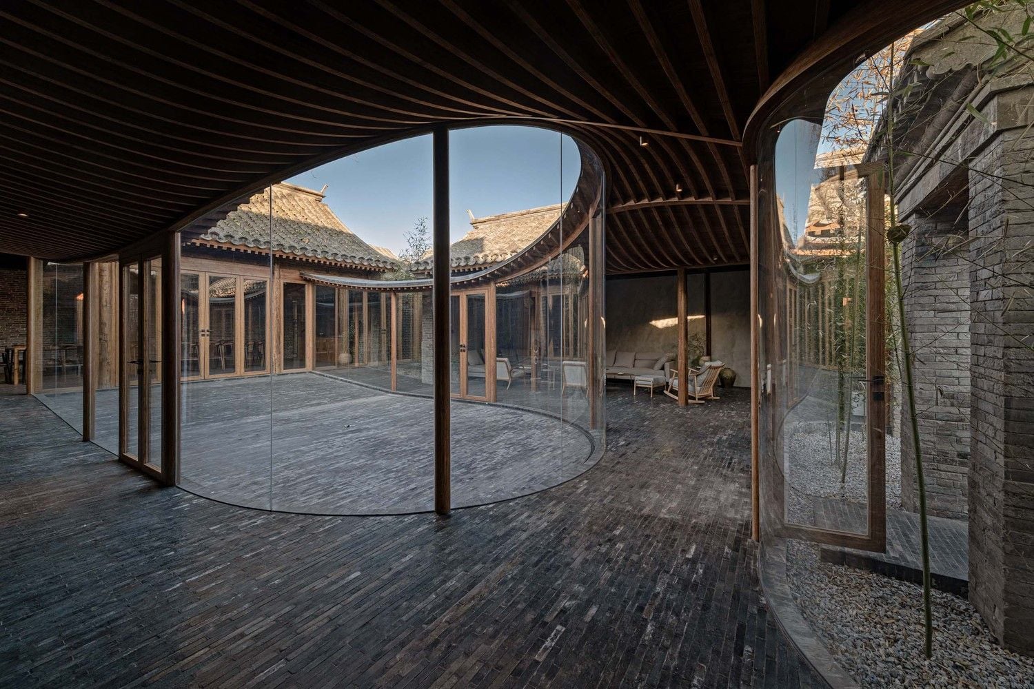 The Qishe Courtyard's billowing glass additions wrap around small 