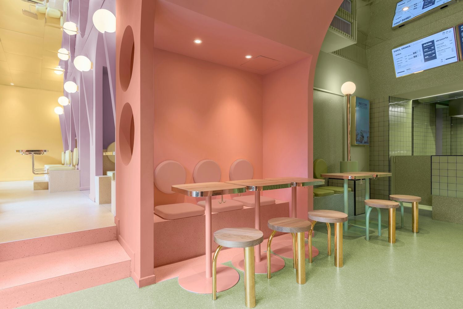 Multicolored pastel spaces inside the Masquespacio-designed Bun burger restaurant in Milan.