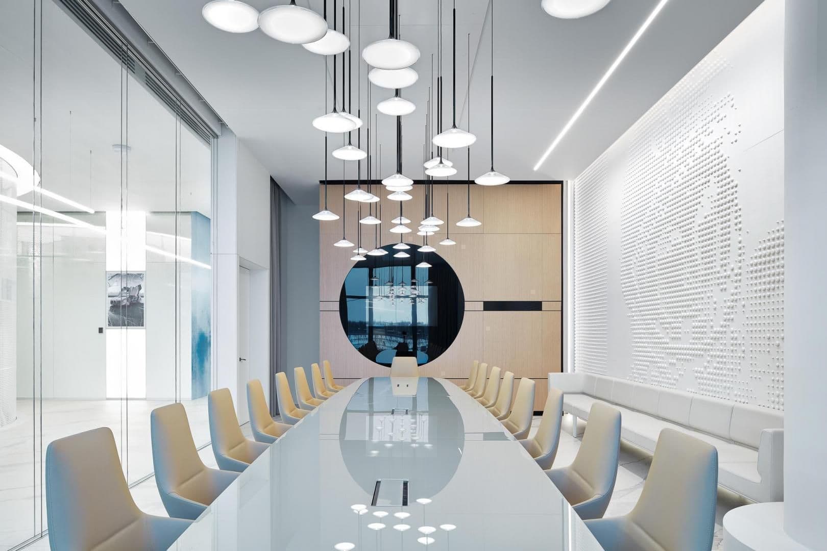 A conference room inside the new lounge features a relief of Gagarin's face, space-age pendant lights, and a shiny reflective tabletop. 