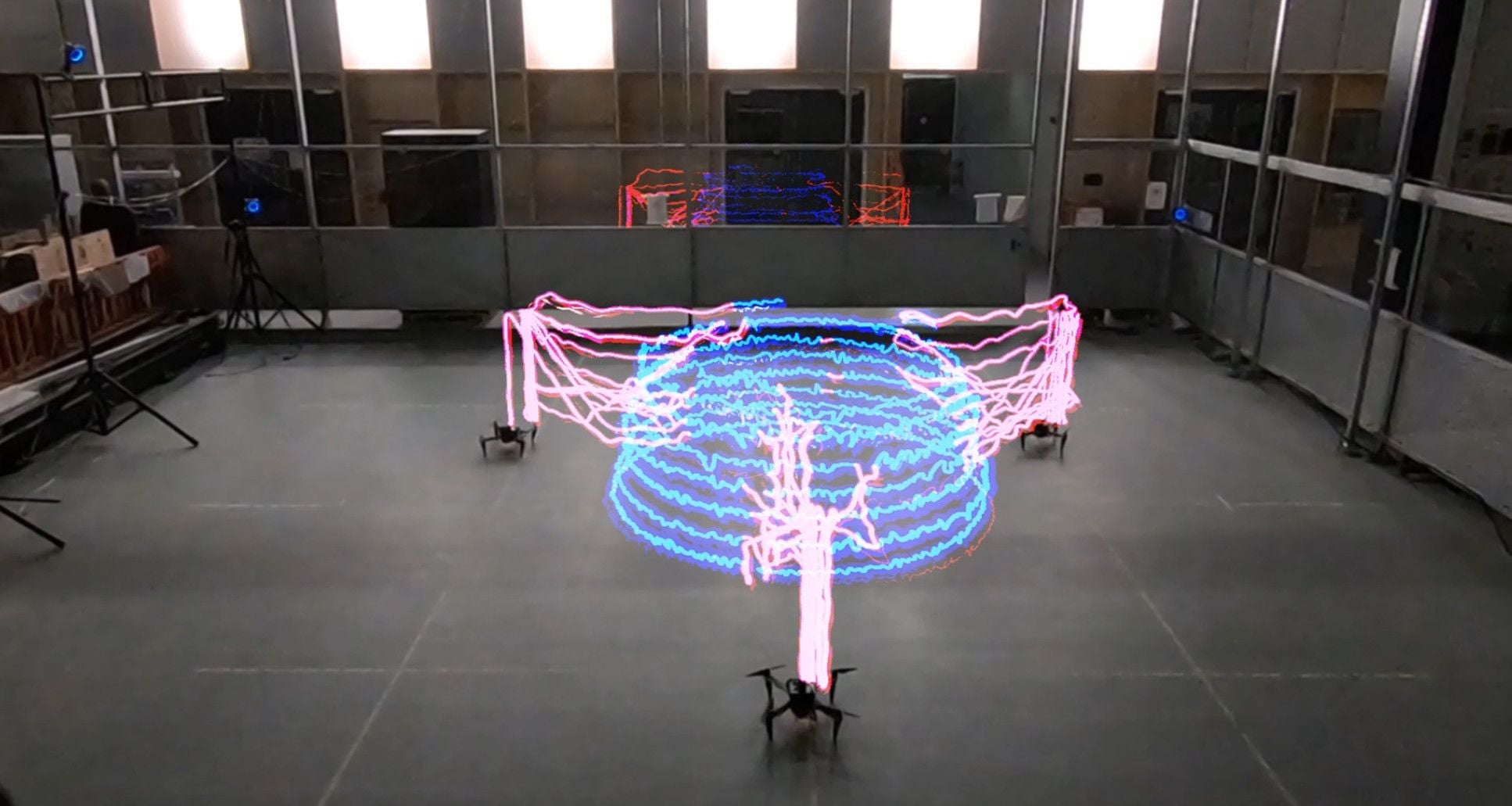 Bee-like 3D printing drones work together to build tower-like structures.