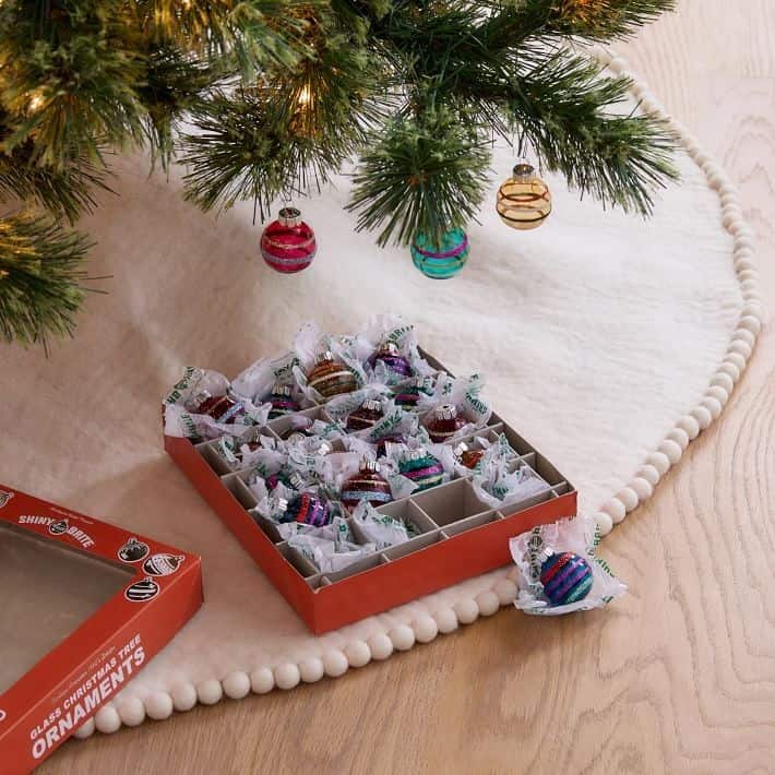 This similarly-shiny ornament set goes perfect with West Elm's new tree topper!