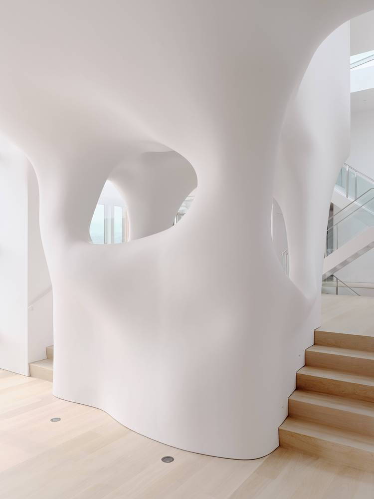 Sculptural cloud-like stairway inside the OPA renovated 