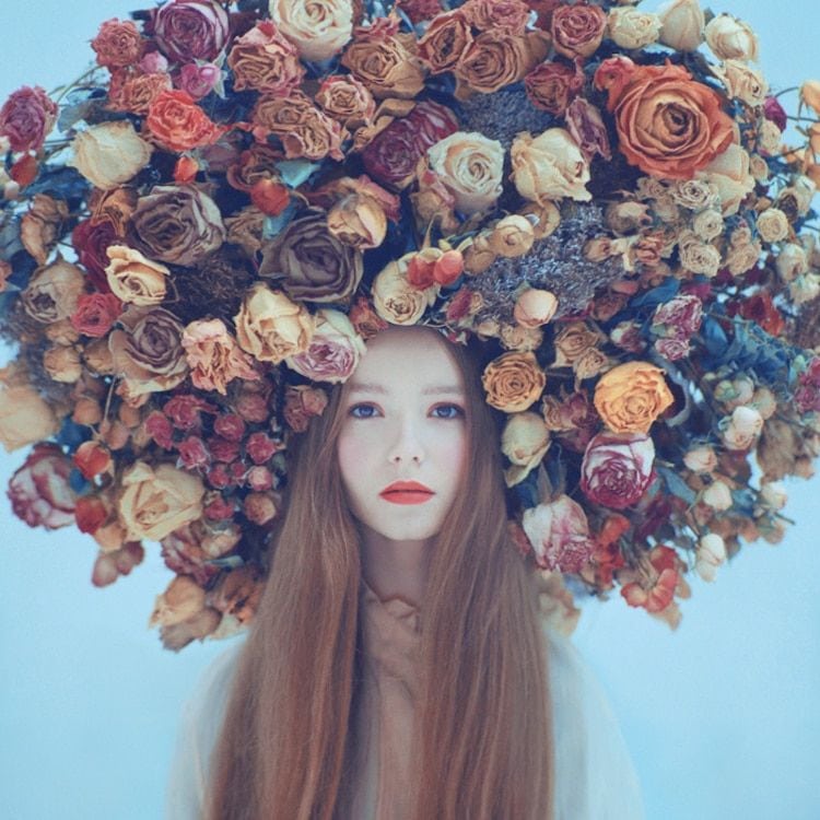 Surreal photograph by Ukrainian artist Oleg Oprisco shows a woman wearing the traditional Ukrainian flower crown known as the 