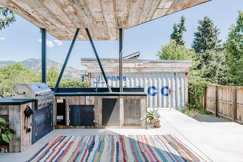 The shipping container home's partially covered patio offers the perfect place to take in the views and grill.