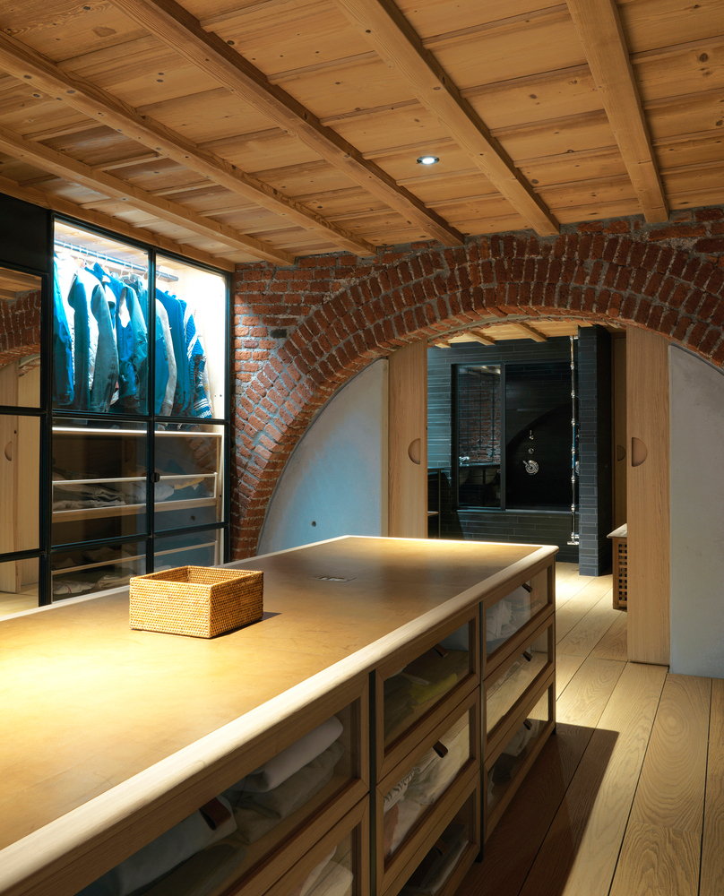 Converted Milan garage closet with brick arch