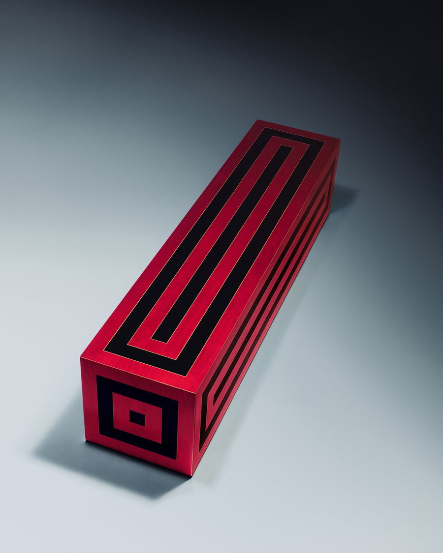 A sculptural red and black bench featured in Jonathan Saunders' debut furniture collection.