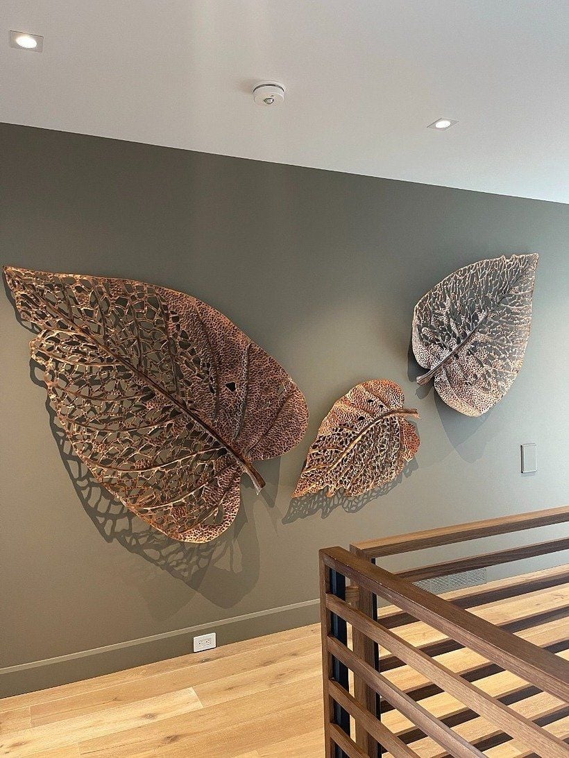 Hanging sculptural leaves from the Phillips Collection on display at Las Vegas Market.