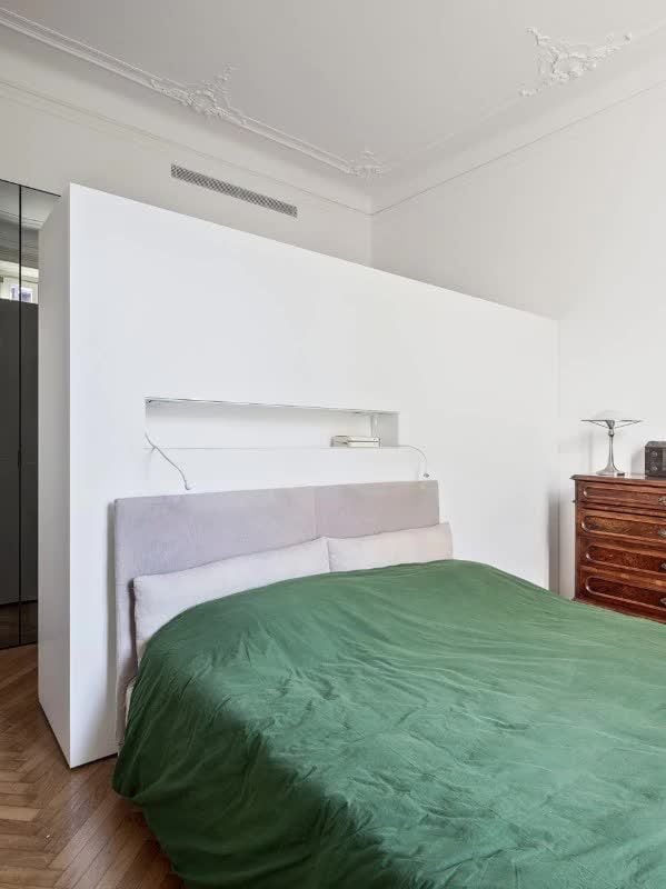 The bedrooms in the Elena Martucci-renovated loft are decidedly minimalistic, focusing on cleanliness and (of course) storage over all. 