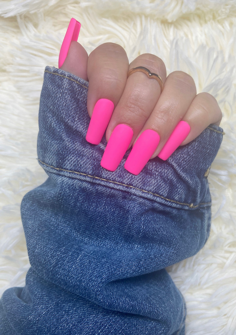 Long, hot pink nails.