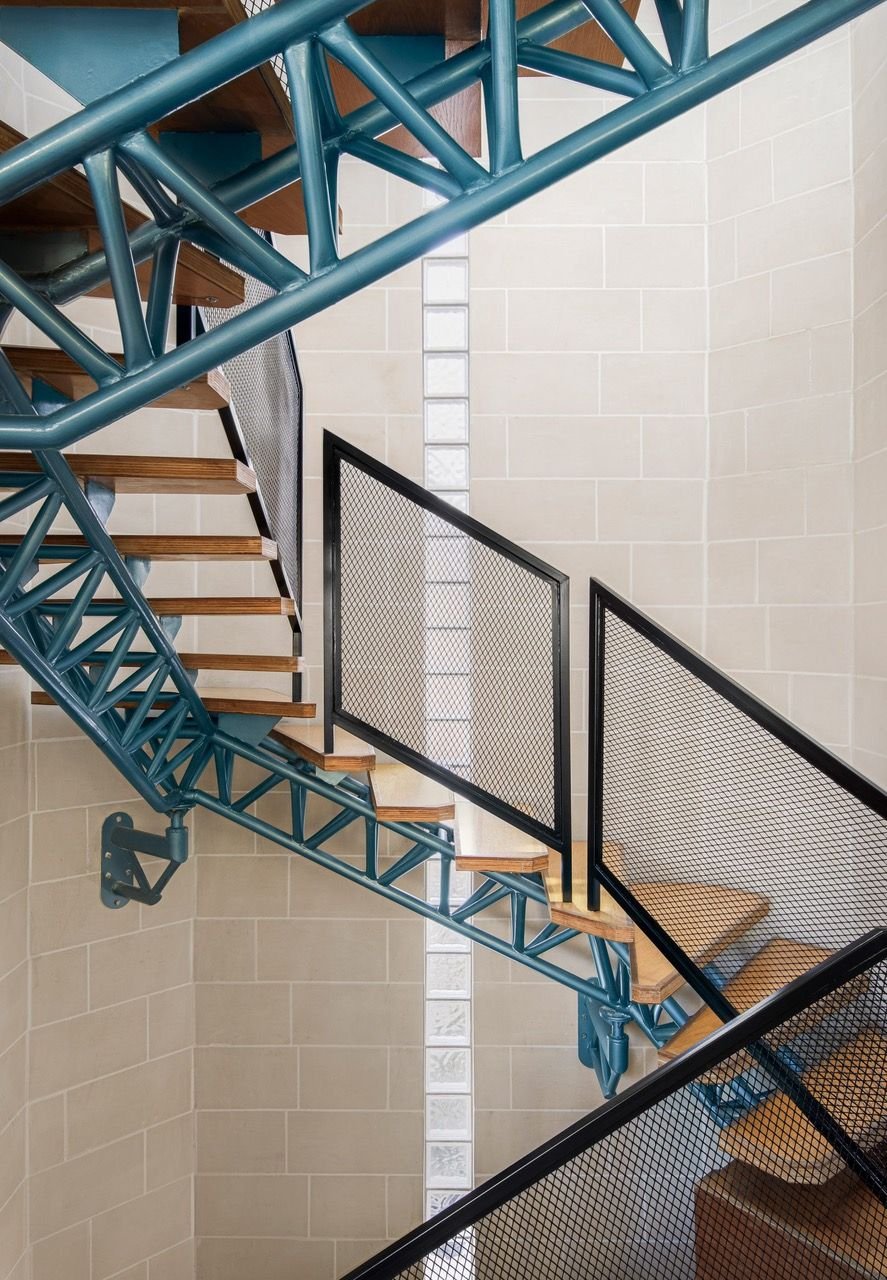 Sculptural staircase leading up to the Valentino Architects-renovated 