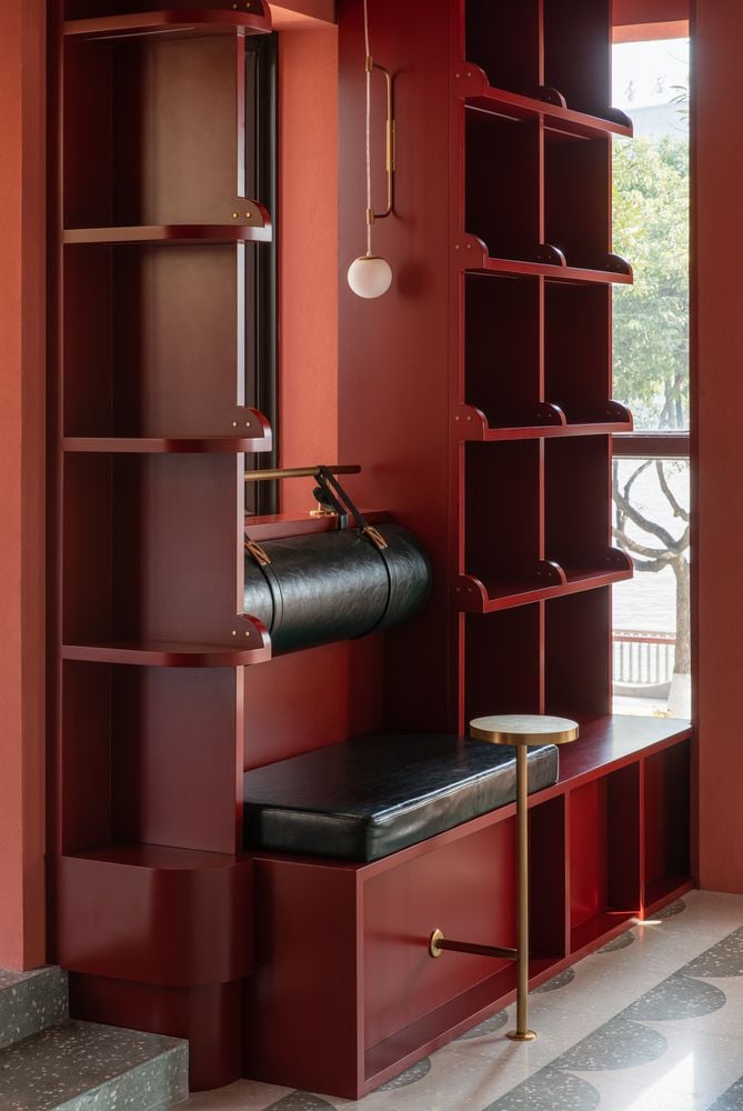 Built-in reading booth on the Bund Post Office's upper level, featuring leather upholstery and custom lighting.