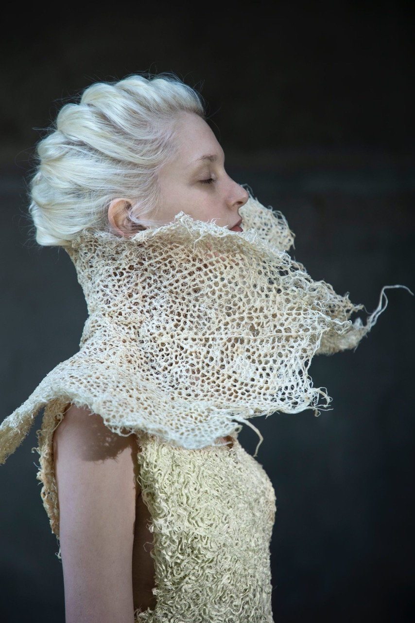 Model dons a woven root grass garment by designer Zena Holloway.