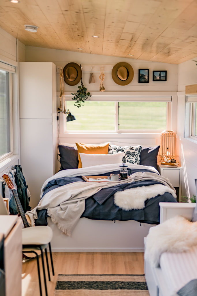 Cute, simple bedroom area inside IKEA's new tiny home offering, made in collaboration with RV manufacturer Escape.