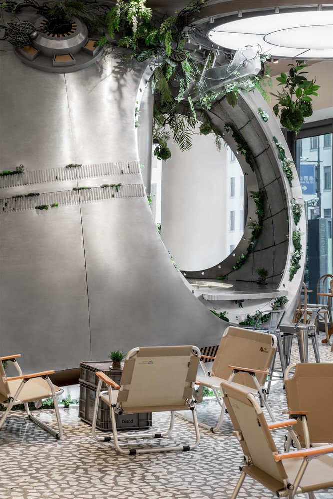 Seating inside Shanghai's Metal Hands Coffee Shop, with the central space pod visible in the background.