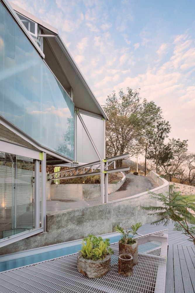 The translucent glass panes all around Casa Cañadas reflect the colors of the sky.