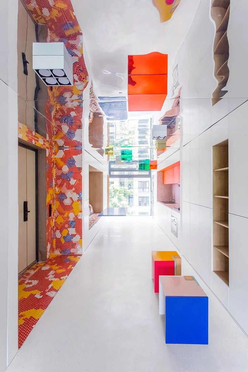 The 000 Design-designed “Live & Fun” apartment in Chongqing, China makes heavy use of colorful tile mosaics for a bold but relaxing effect.  