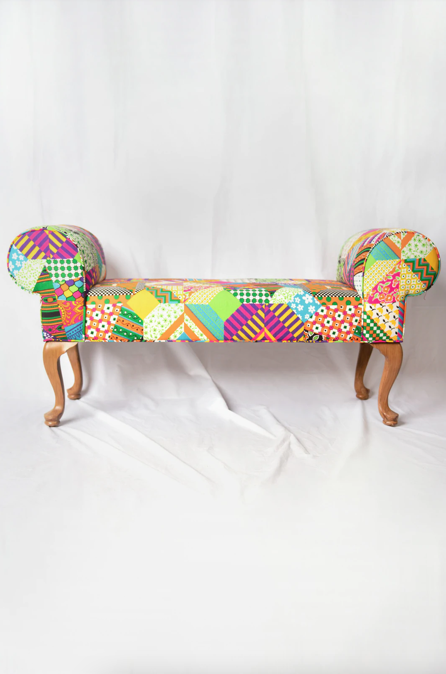 Brightly-patterned bench featured in Batsheva Hay's Batsheva Home collection.