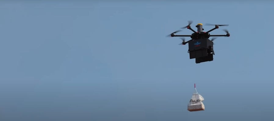An Air Loco delivery drone delivers food to a hungry customer's house.