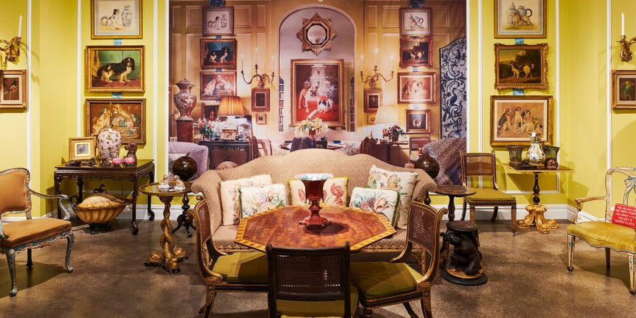 Ornate majolica pottery displayed all around a lavish maximalist living room.