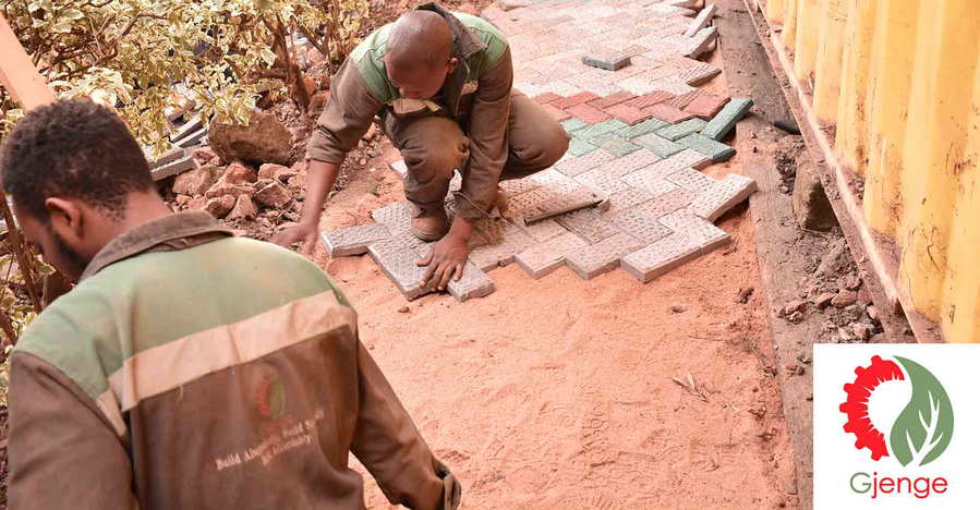 Matee's Gjenge Makers Ltd. team lays the finished bricks out in a Kenyan courtyard to create a patio area.