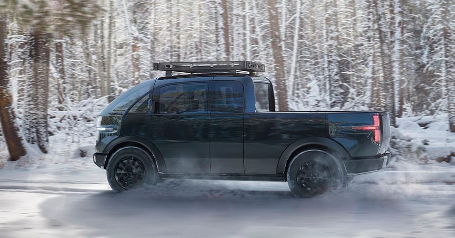 Canoo Electric Pickup Truck zips through the snowy terrain.