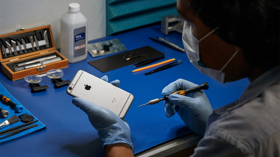 Technician uses specialized parts to repair an Apple iPhone