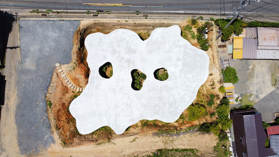 Bird's eye view of the House and Restaurant Cave's flat white roof.