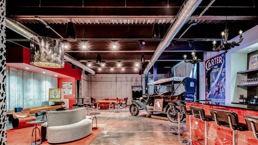 Historic car and bold splashes of red put a hip contemporary spin on the Harman Hall home's former speakeasy.