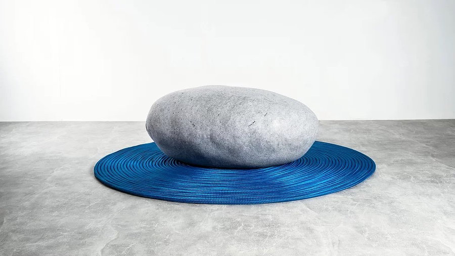 Mousarris Design Studio's Zen Kusshion, designed to resemble a boulder in the middle of a rippling pond.