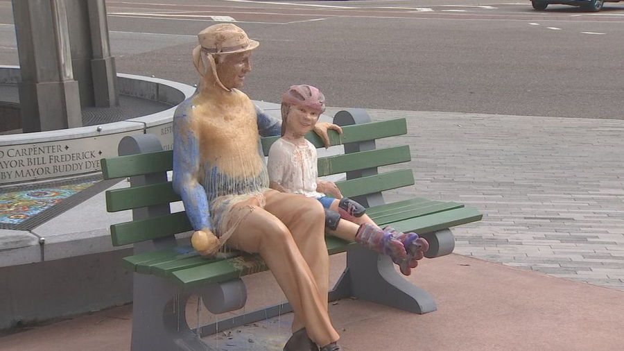 For the final sculpture of the series, the artists sculpted a chipper grandfather smiling alongside his young granddaughter.