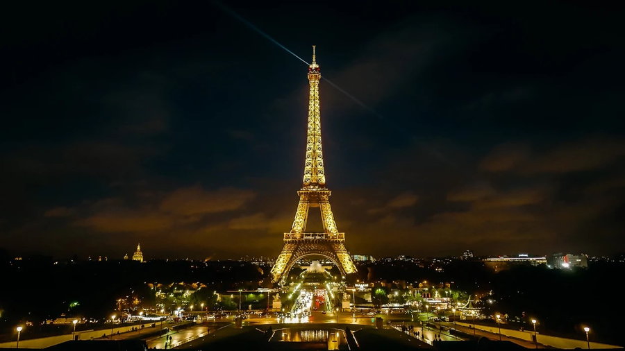Paris' iconic Eiffel Tower lit up at night.