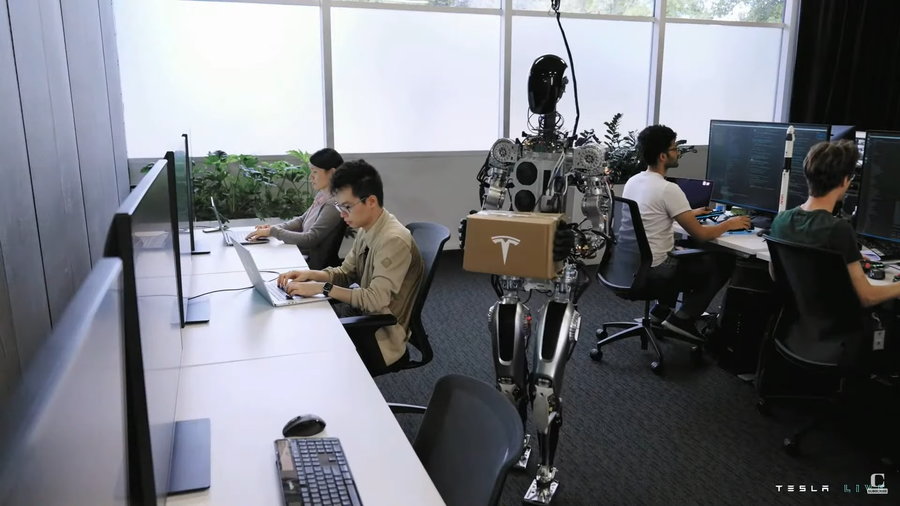 Tesla's humanoid Optimus robot delivers packages around Tesla HQ.
