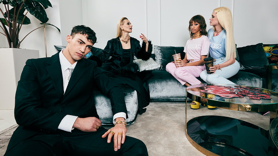 Young people lounge in style inside Versace's new flagship Home store in Milan.