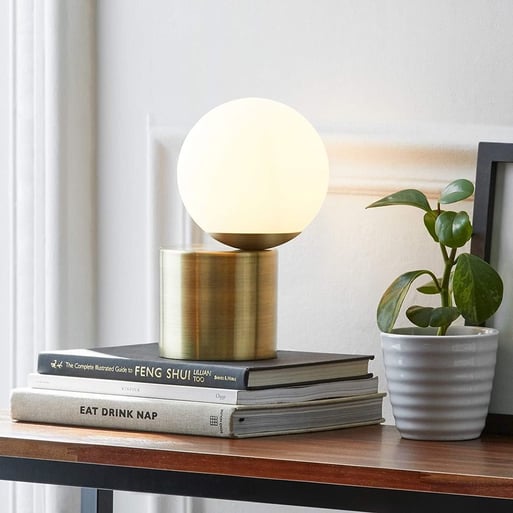 Rivet Modern Glass Globe Desk Lamp, available on Amazon.