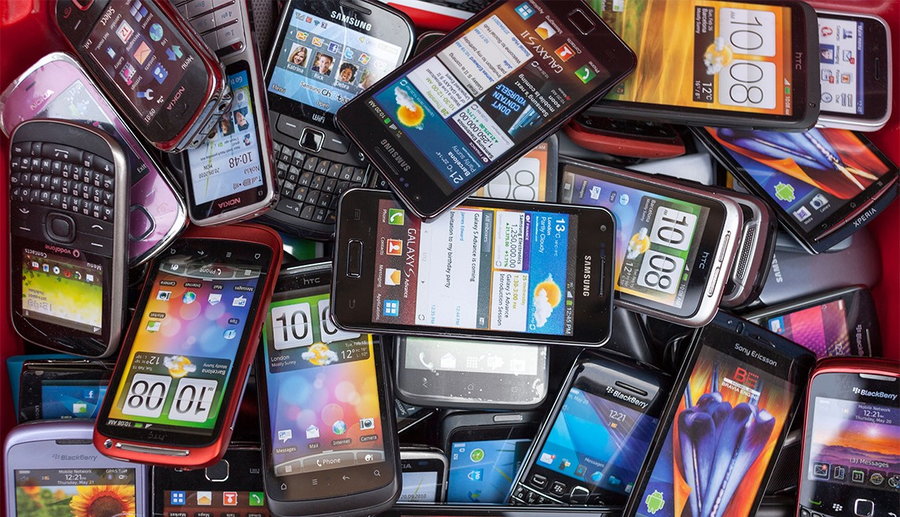 Pile of old, discarded smartphones.