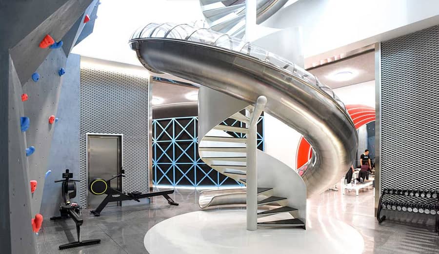 A curving metallic slide sits at the center of Beijing's new MFIT SPACE 01 gym. 
