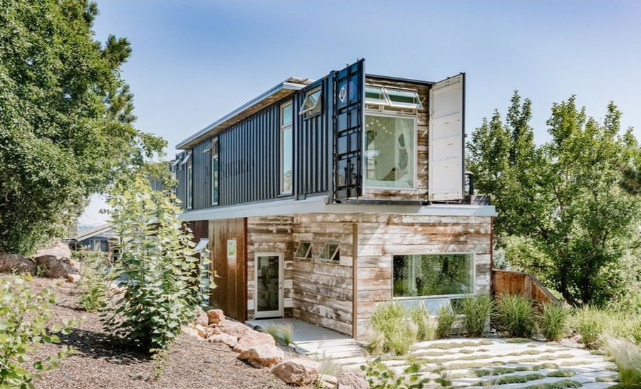 Exterior side shot of a gorgeous upcycled shipping container home outside Boulder, Colorado.