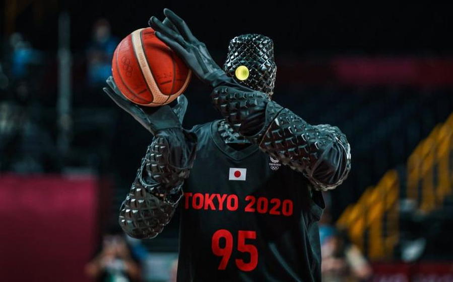 Toyota's CUE5 basketball playing robot prepare to take a shot