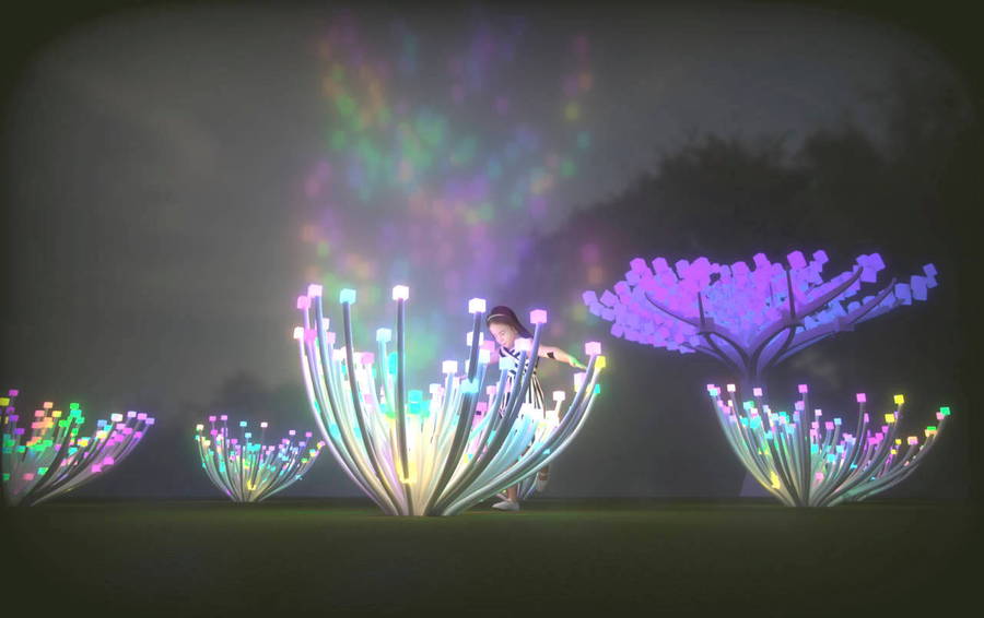 Park-goers interact with one of Charles Gadeken's colorful LED 