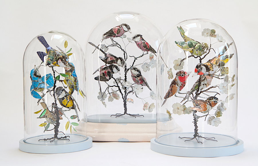 Gorgeous upcycled metal birds in bell jars, all crafted by Barbara Franc. 